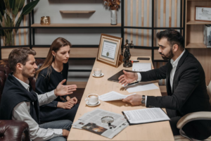 Parent advocate speaking with parents during a supportive custody guidance conversation